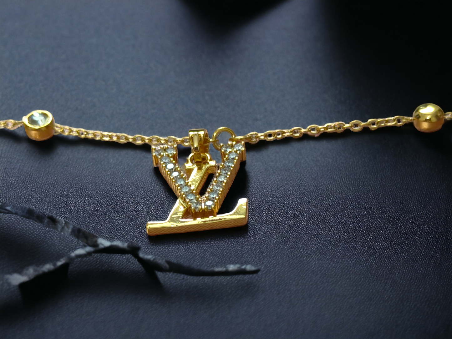 Radiant Gold 'V' Charm Necklace